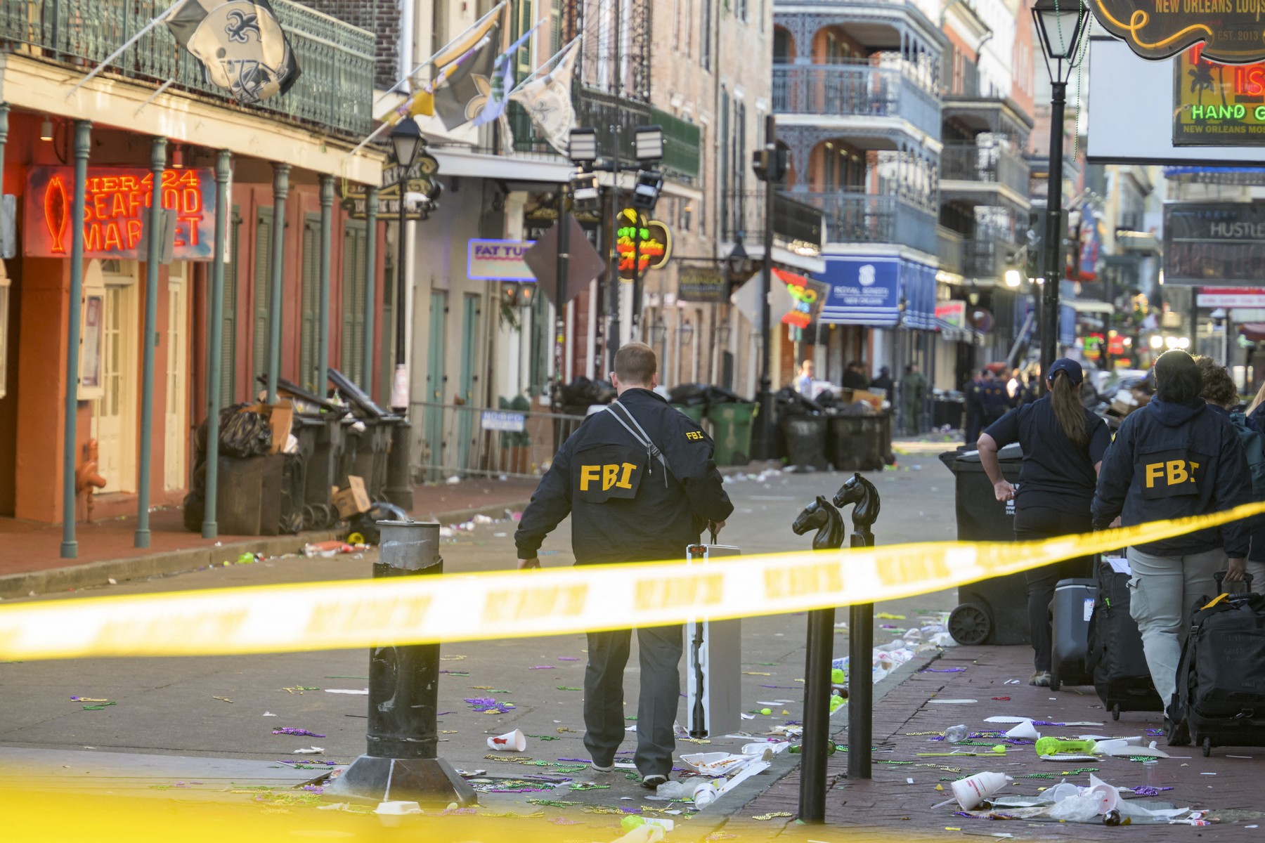 FBI investigators arrive at the scene where the white Ford F-150 pickup truck that crashed into a work lift after allegedly driving into a crowd of New Year's revelers in the French Quarter of New Orleans, Louisiana, on January 1, 2025. At least 10 people were killed and 30 injured Wednesday when a vehicle plowed overnight into a New year's crowd in the heart of the thriving New Orleans tourist district, authorities in the southern US city said.,Image: 951237976, License: Rights-managed, Restrictions: , Model Release: no, Credit line: Matthew HINTON / AFP / Profimedia