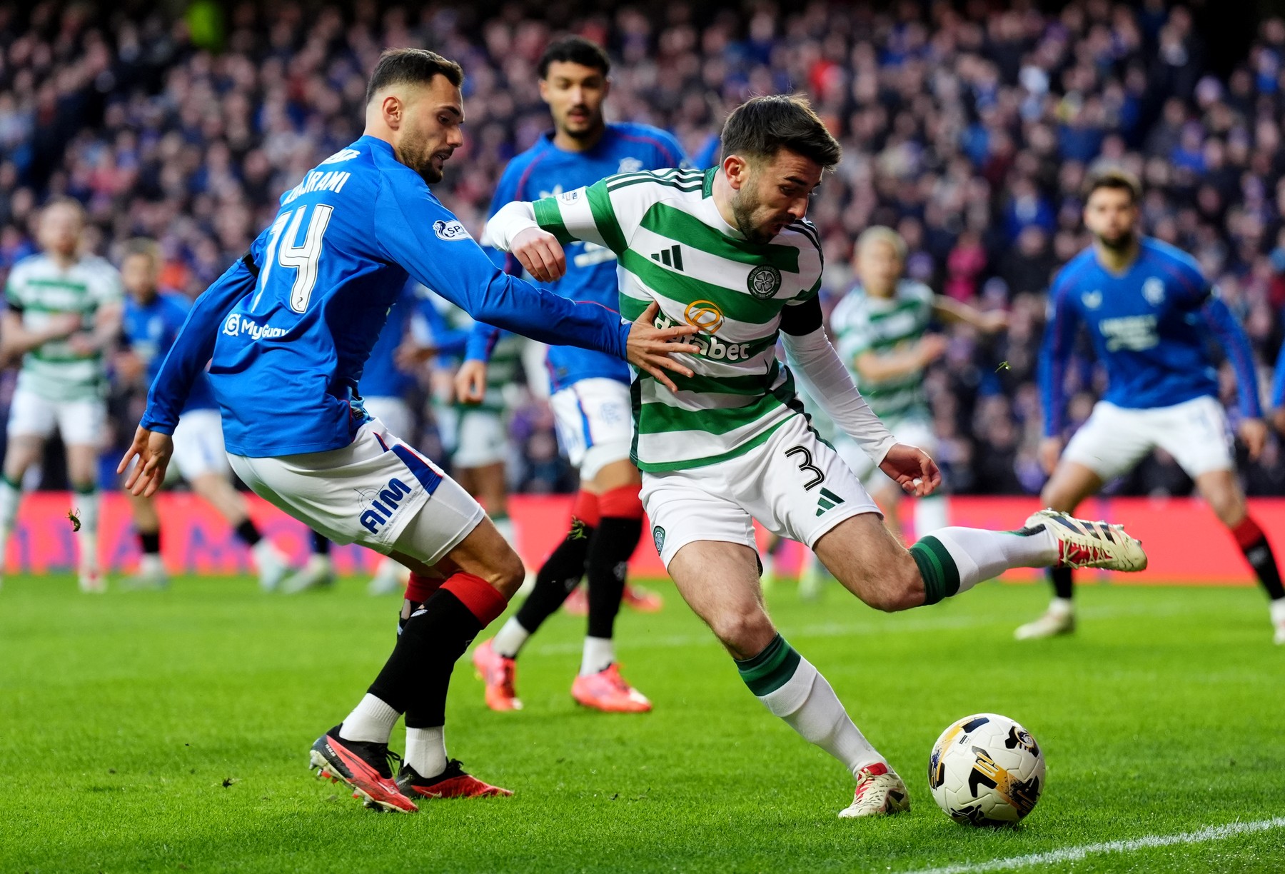 Celtic's Greg Taylor (right) and Rangers' Nedim Bajrami (left) battle for the ball during the William Hill Premiership match at Ibrox Stadium, Glasgow. Picture date: Thursday January 2, 2025.,Image: 951364949, License: Rights-managed, Restrictions: Use subject to restrictions. Editorial use only, no commercial use without prior consent from rights holder., Model Release: no, Credit line: Andrew Milligan / PA Images / Profimedia