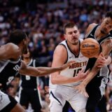 Jan 3, 2025; Denver, Colorado, USA; Denver Nuggets center Nikola Jokic (15) battles for a loose ball with San Antonio Spurs center Victor Wembanyama (1) and forward Harrison Barnes (40) in the third quarter at Ball Arena.,Image: 951671830, License: Rights-managed, Restrictions: *** Worldwide Rights Except Baltics, China, Denmark, Finland, Germany, Hong Kong, Japan, Macau, Norway, Poland, South Korea, Sweden, and Taiwan *** No sales outside your territory. No 3rd parties. No redistribution ***, Model Release: no, Credit line: Imagn Images / ddp USA / Profimedia