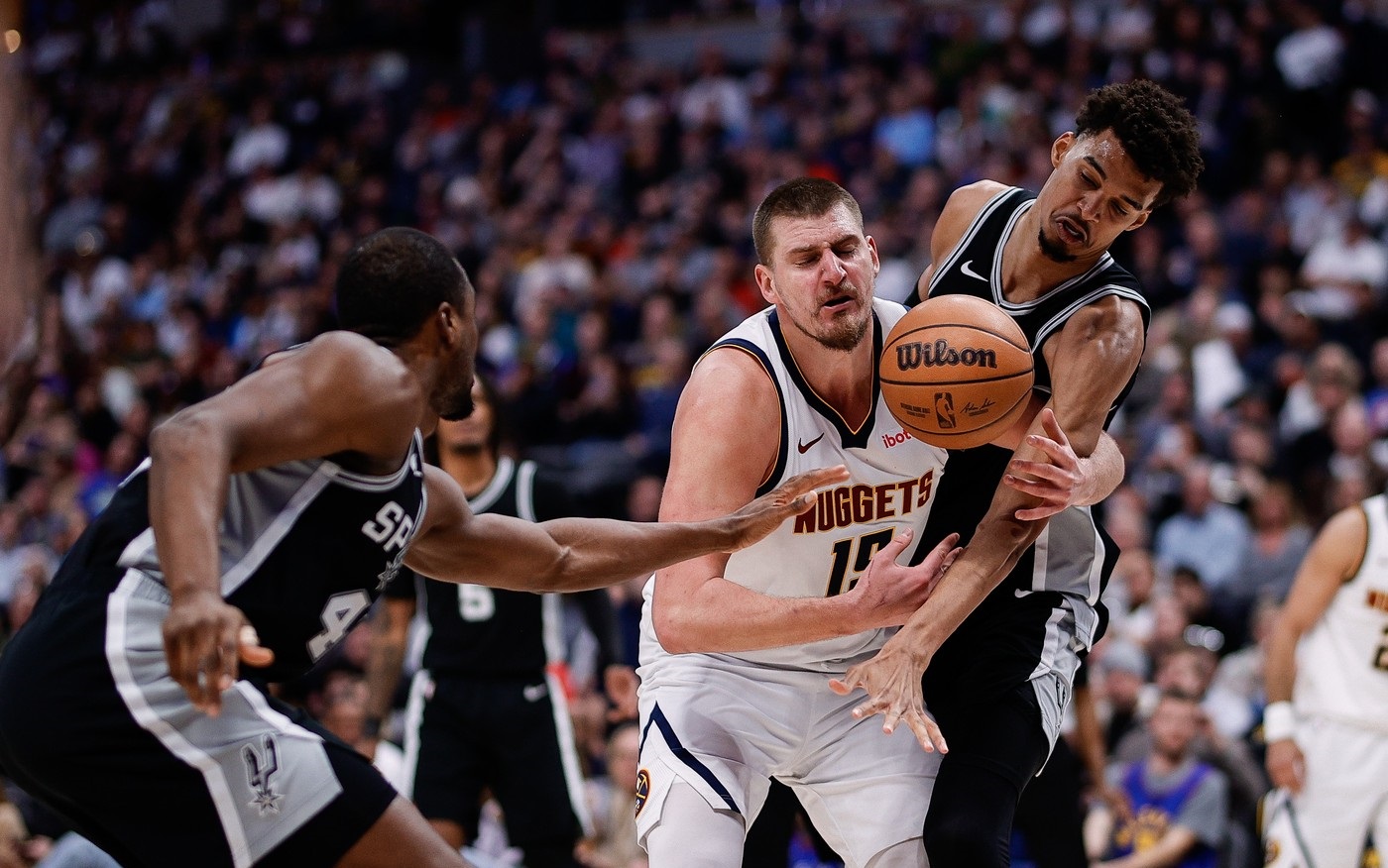 Jan 3, 2025; Denver, Colorado, USA; Denver Nuggets center Nikola Jokic (15) battles for a loose ball with San Antonio Spurs center Victor Wembanyama (1) and forward Harrison Barnes (40) in the third quarter at Ball Arena.,Image: 951671830, License: Rights-managed, Restrictions: *** Worldwide Rights Except Baltics, China, Denmark, Finland, Germany, Hong Kong, Japan, Macau, Norway, Poland, South Korea, Sweden, and Taiwan *** No sales outside your territory. No 3rd parties. No redistribution ***, Model Release: no, Credit line: Imagn Images / ddp USA / Profimedia