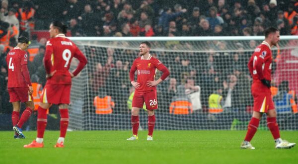 Liverpool's Andrew Robertson (centre) reacts after conceding a second goal to Manchester United's Amad Diallo (not pictured) during the Premier League match at Anfield, Liverpool. Picture date: Sunday January 5, 2025.,Image: 951931481, License: Rights-managed, Restrictions: EDITORIAL USE ONLY No use with unauthorised audio, video, data, fixture lists, club/league logos or "live" services. Online in-match use limited to 120 images, no video emulation. No use in betting, games or single club/league/player publications., Model Release: no, Credit line: Peter Byrne / PA Images / Profimedia