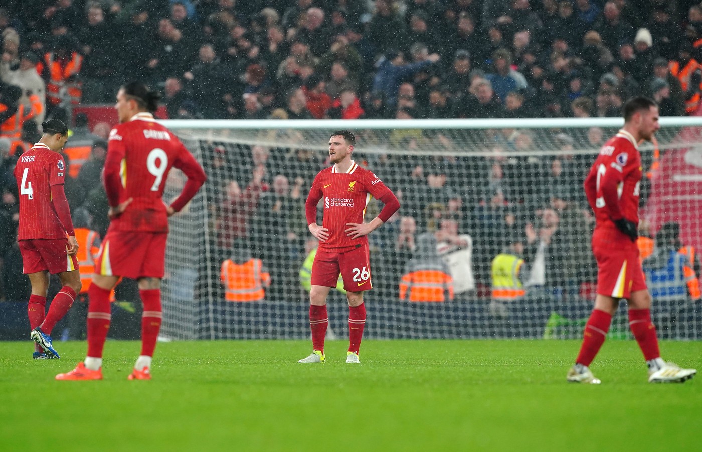 Liverpool's Andrew Robertson (centre) reacts after conceding a second goal to Manchester United's Amad Diallo (not pictured) during the Premier League match at Anfield, Liverpool. Picture date: Sunday January 5, 2025.,Image: 951931481, License: Rights-managed, Restrictions: EDITORIAL USE ONLY No use with unauthorised audio, video, data, fixture lists, club/league logos or "live" services. Online in-match use limited to 120 images, no video emulation. No use in betting, games or single club/league/player publications., Model Release: no, Credit line: Peter Byrne / PA Images / Profimedia