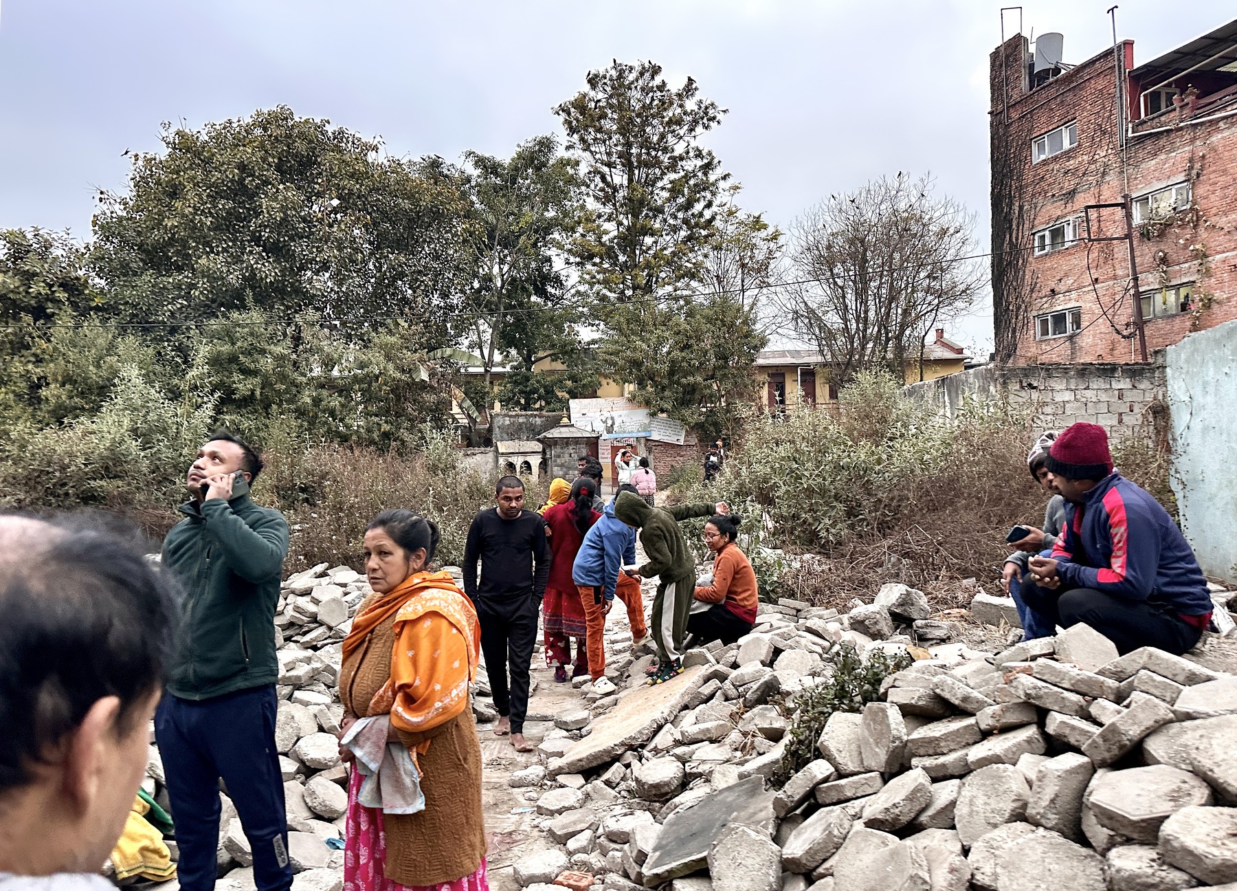 People gather in an open area following earthquake tremors in Kathmandu, in the early hours on January 7, 2025. A powerful earthquake in China's remote Tibet region killed at least 32 people and collapsed "many buildings" on January 7, Chinese media reported, with tremors also felt in neighbouring Nepal's capital Kathmandu and parts of India.,Image: 952178850, License: Rights-managed, Restrictions: , Model Release: no, Credit line: SUNIL SHARMA / AFP / Profimedia