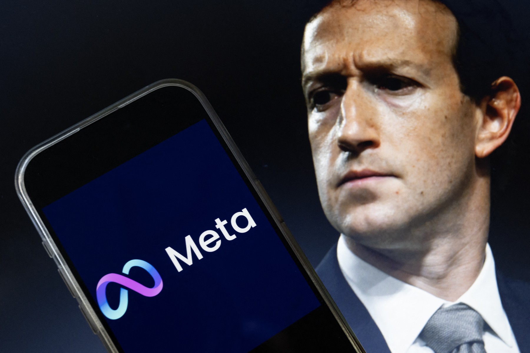 This photo illustration created on January 7, 2025, in Washington, DC, shows an image of Mark Zuckerberg, CEO of Meta, and an image of the Meta logo. Social media giant Meta on January 7, 2025, slashed its content moderation policies, including ending its US fact-checking program, in a major shift that conforms with the priorities of incoming president Donald Trump.,Image: 952237919, License: Rights-managed, Restrictions: , Model Release: no, Credit line: Drew ANGERER / AFP / Profimedia