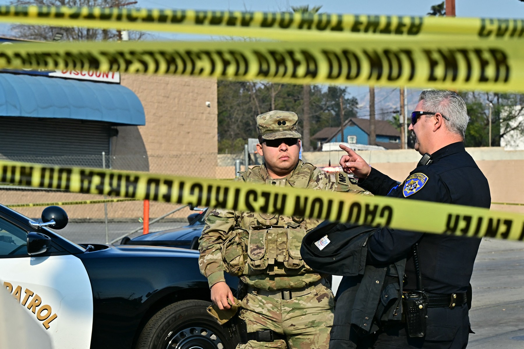 A National Guard soldier speaks with a police officer at a roadblock in Altadena, California, on January 10, 2025, during the Eaton Fire. Massive wildfires that engulfed whole neighborhoods and displaced thousands in Los Angeles have killed at least 10 people, authorities said, as California's National Guard soldiers readied to hit the streets to help quell disorder.
News of the growing toll, announced late Thursday January 9 by the Los Angeles County Medical Examiner, came as swaths of the United States' second-largest city lay in ruins.,Image: 952788954, License: Rights-managed, Restrictions: , Model Release: no, Credit line: Frederic J. Brown / AFP / Profimedia