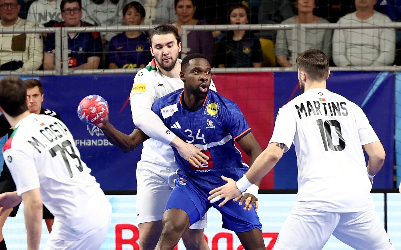 France's left back # 34 Karl Konan (C) fights for the ball with Portugal's center half #10 Miguel Martins (2nd L)  during a friendly handball match between France and Portugal at the Rhenus Stadium in Strasbourg, eastern France, on January 10, 2025.,Image: 952822384, License: Rights-managed, Restrictions: , Model Release: no, Credit line: FREDERICK FLORIN / AFP / Profimedia