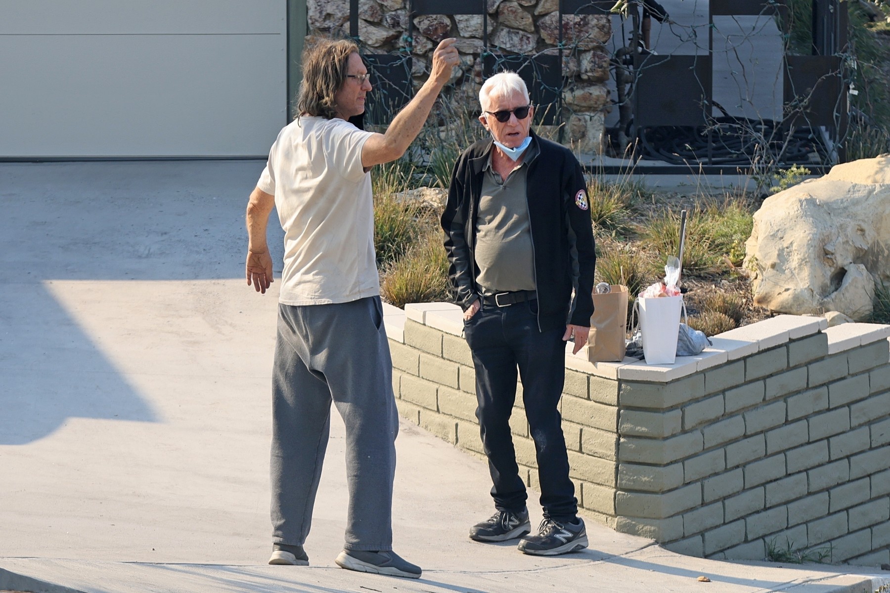 Pacific Palisades, CA  - *EXCLUSIVE*  - Actor James Woods returned to his Pacific Palisades home after the Los Angeles wildfires.  Pictured here wearing a face mask and chatting with law enforcement and neighbors.

*UK Clients - Pictures Containing Children
Please Pixelate Face Prior To Publication*,Image: 952858542, License: Rights-managed, Restrictions: , Model Release: no, Pictured: James Woods, Credit line: BACKGRID / Backgrid USA / Profimedia