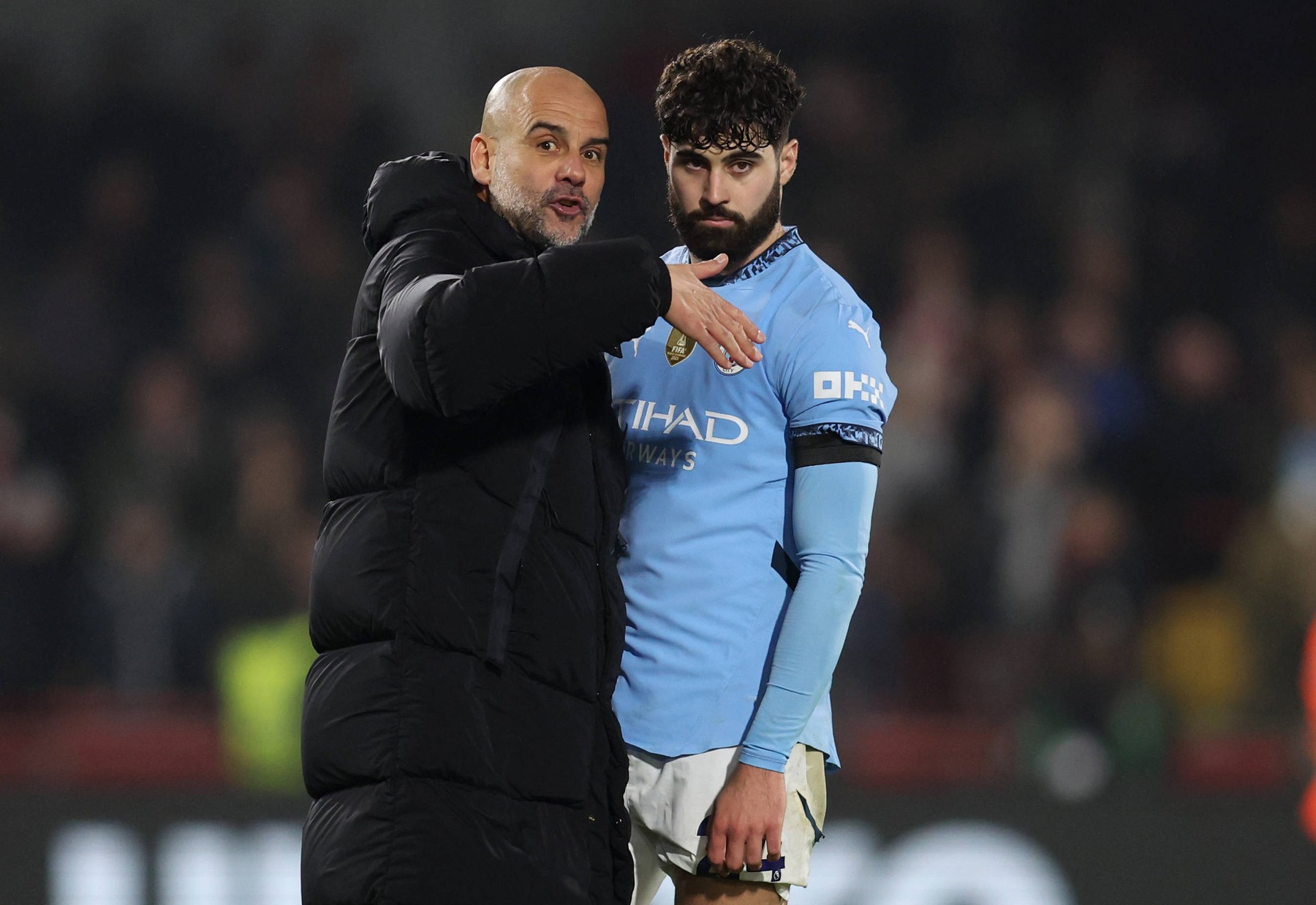 London, England, 14th January 2025. Pep Guardiola, head coach of Manchester City talks with Josko Gvardiol of Manchester City after the Premier League match at Gtech Community Stadium, London. Picture credit should read: / Sportimage EDITORIAL USE ONLY. No use with unauthorised audio, video, data, fixture lists, club/league logos or live services. Online in-match use limited to 120 images, no video emulation. No use in betting, games or single club/league/player publications. SPI_051_PT_Brentford_Man_City SPI-3597-0051,Image: 953663092, License: Rights-managed, Restrictions: , Model Release: no, Credit line: Paul Terry / imago sportfotodienst / Profimedia