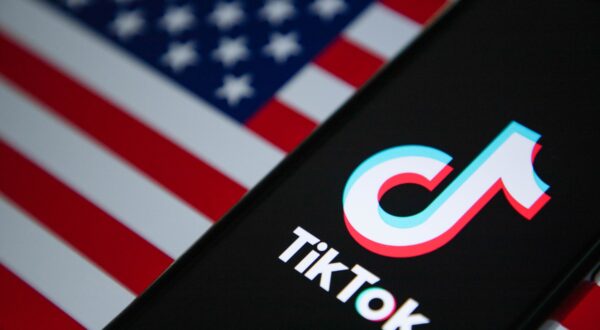 January 18, 2025, India: In this photo illustration, the TikTok logo is seen displayed on a mobile phone screen with American flag in the background.,Image: 954545153, License: Rights-managed, Restrictions: , Model Release: no, Credit line: Faisal Bashir / Zuma Press / Profimedia