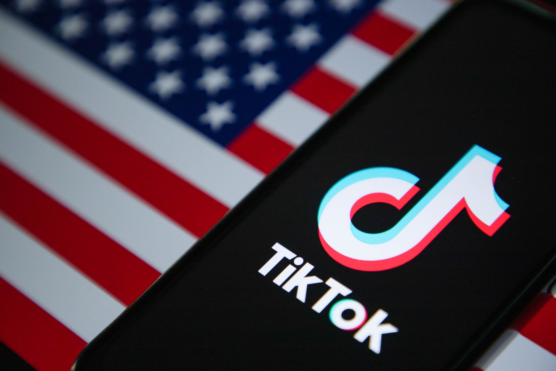 January 18, 2025, India: In this photo illustration, the TikTok logo is seen displayed on a mobile phone screen with American flag in the background.,Image: 954545153, License: Rights-managed, Restrictions: , Model Release: no, Credit line: Faisal Bashir / Zuma Press / Profimedia