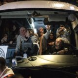 Palestinian freed prisoners wave to the crowd from a Red Cross bus that drove them out of the Israeli Ofer military prison in the occupied West Bank, as they arrive in Beitunia, on the outskirts of Ramallah, in the early hours of January 20, 2025. Crowds cheered, chanted and honked car horns as two buses carrying some 90 Palestinian prisoners freed from an Israeli jail as part of the Gaza ceasefire deal that began on January 19 and saw three Israeli hostages freed by Hamas in the Gaza Strip.,Image: 955502244, License: Rights-managed, Restrictions: , Model Release: no, Credit line: JOHN WESSELS / AFP / Profimedia