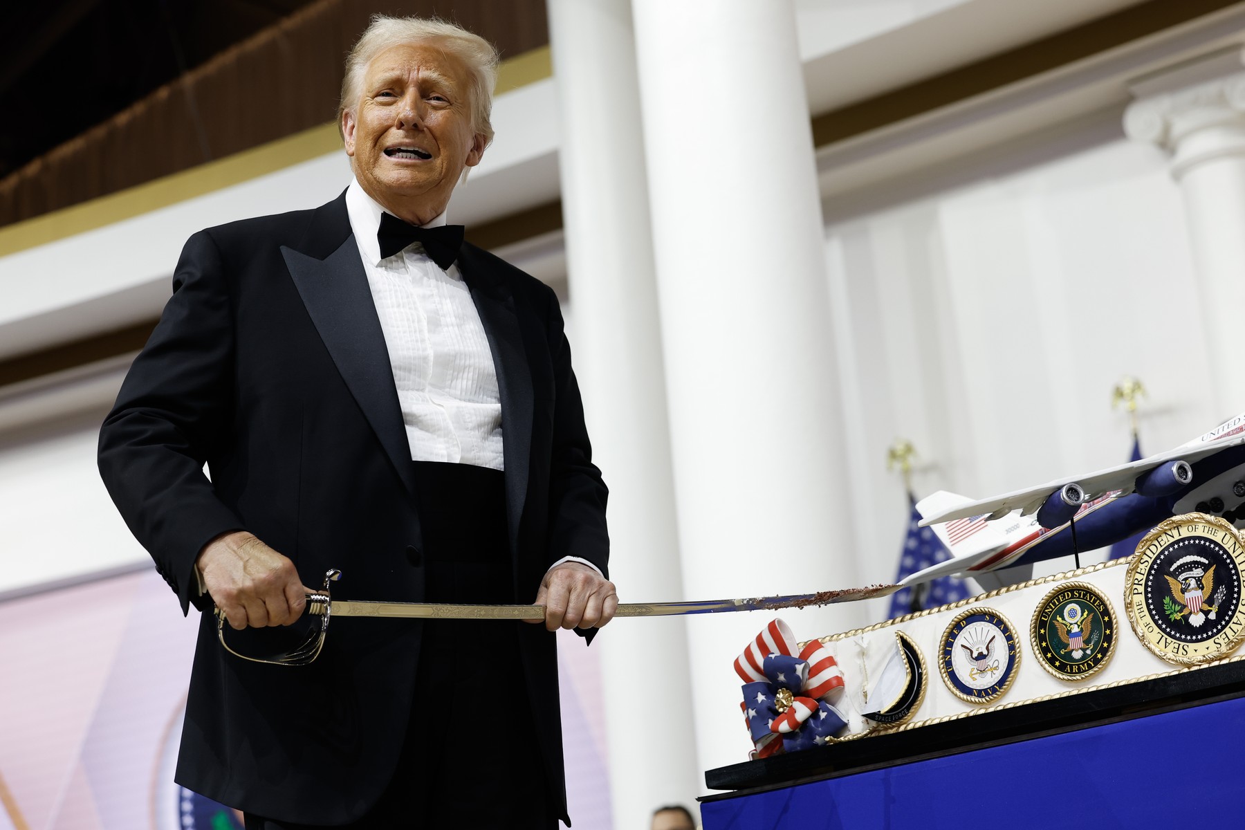 President Donald Trump cuts a cake at the Commander-in-Chief Ball on January 20, 2025 in Washington, DC.  President Trump attends some of the inaugural balls after taking the oath as the 47th president.

Featuring: Donald Trump
Where: Washington, District of Columbia, United States
When: 20 Jan 2025
Credit: POOL via CNP/INSTARimages.com,Image: 955987955, License: Rights-managed, Restrictions: , Model Release: no, Credit line: Anna Moneymaker - Pool via CNP / INSTAR Images / Profimedia