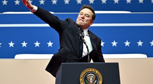 (FILES) Tesla and SpaceX CEO Elon Musk gestures as he speaks during the inaugural parade inside Capitol One Arena, in Washington, DC, on January 20, 2025. Musk's hand gestures at an inauguration event for US President Donald Trump, which quickly drew comparisons to Nazi salutes, appear to have resonated in some far-right extremist spaces online. Several neo-Nazi leaders have shared clips of the viral moment from Musk's Monday speech, in which the billionaire brought his hand to his chest and extended it straight out, twice, before saying: "My heart goes out to you.",Image: 956197585, License: Rights-managed, Restrictions: , Model Release: no, Credit line: ANGELA WEISS / AFP / Profimedia