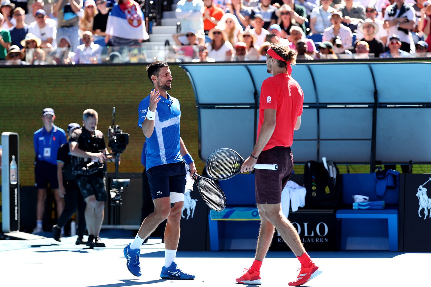 Serbia's Novak Djokovic (L) shakes hands with Germany's Alexander Zverev after retiring from the men's singles semifinal on day thirteen of the Australian Open tennis tournament in Melbourne on January 24, 2025.,Image: 957112177, License: Rights-managed, Restrictions: -- IMAGE RESTRICTED TO EDITORIAL USE - STRICTLY NO COMMERCIAL USE --, Model Release: no, Credit line: Martin KEEP / AFP / Profimedia